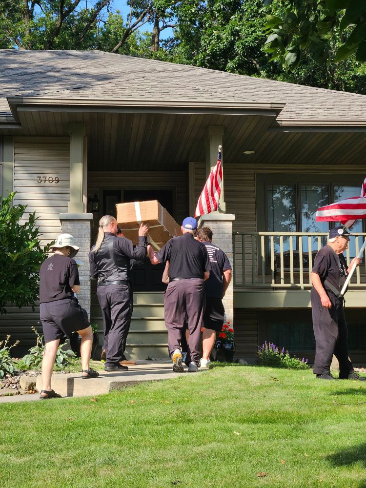 Carrying the coffin up the porch stairs