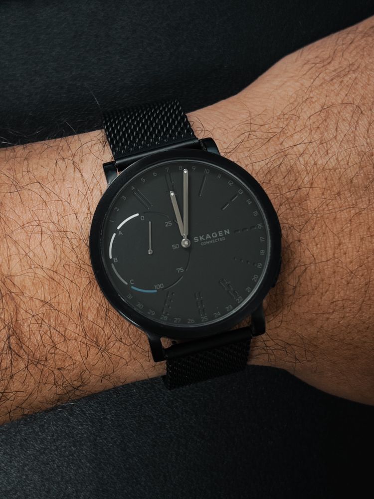 Photo of a wrist wearing a black Skagen Hybrid Smartwatch