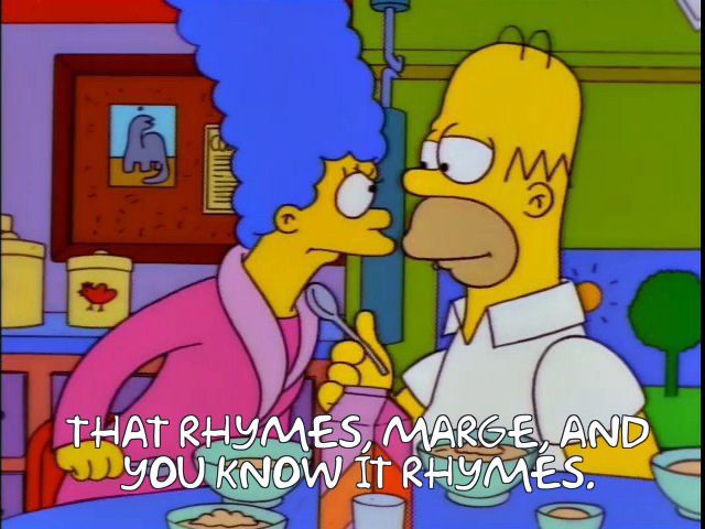 Still from Simpsons Season 9 Episode 22 “Trash of the Titans” with Homer saying to Marge, “that rhymes, Marge, and you know it rhymes.”