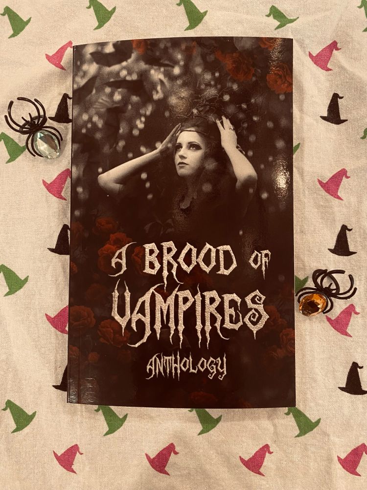 A Brood of Vampires anthology on a witch hat background 