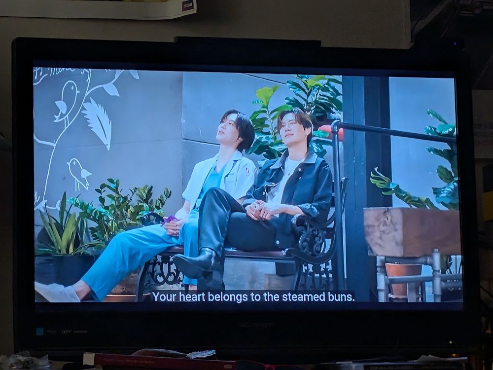 Two Thai vampires just chilling, one of them says "your heart belongs to the steamed buns"