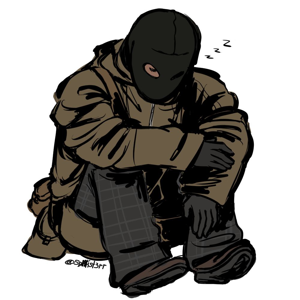 bell sitting down with his arms wrapped over his knees with his eyes closed.