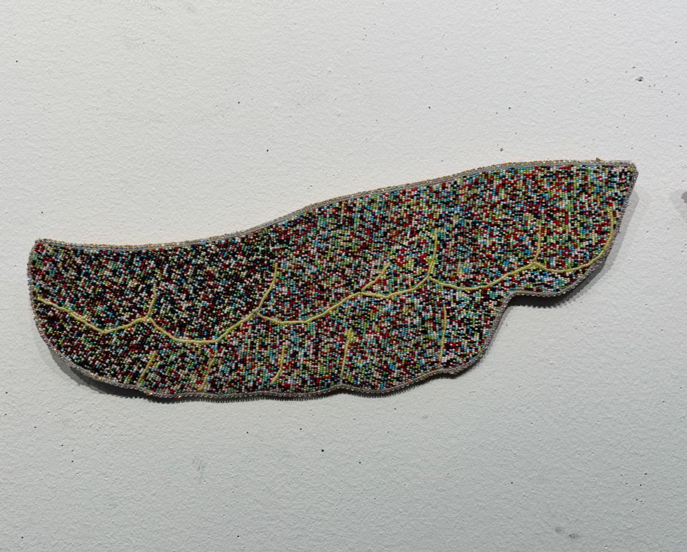 Left side of Bead Soup Wings, the background is a white wall.