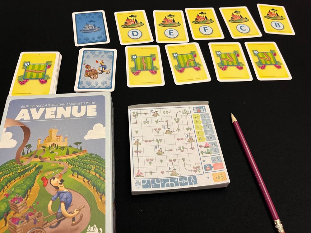 103 points in the roll and write game Avenue, with game box and route cards with grapes and vineyards