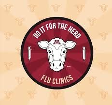 From the University of Minnesota, a circular maroon sticker with a white cow head in the center, a white inverted needle and syringe on either side, and white text that reads, "DO IT FOR THE HERD" and "FLU CLINICS" arcing around it