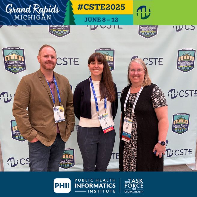 Sarah Shaw poses with fellow attendees at the CSTE Annual Conference. They pose in front of CSTE logo with Grand Rapids, Mich. text. 