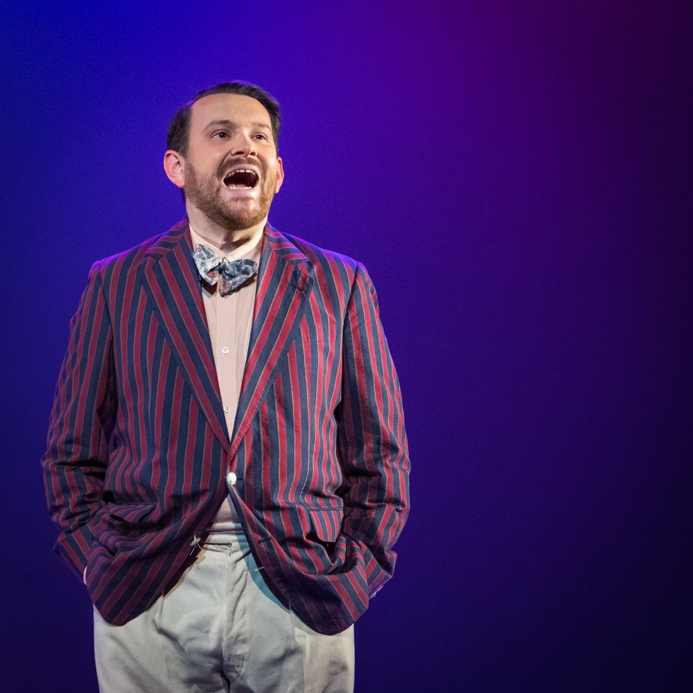 Giffnock Theatre Players - "The Great Gatsby" is a 1925 novel by American writer F. Scott Fitzgerald. Set in the Jazz Age on Long Island, near New York City, the novel depicts first-person narrator Nick Carraway's depicted in this image in his blazer and slacks.