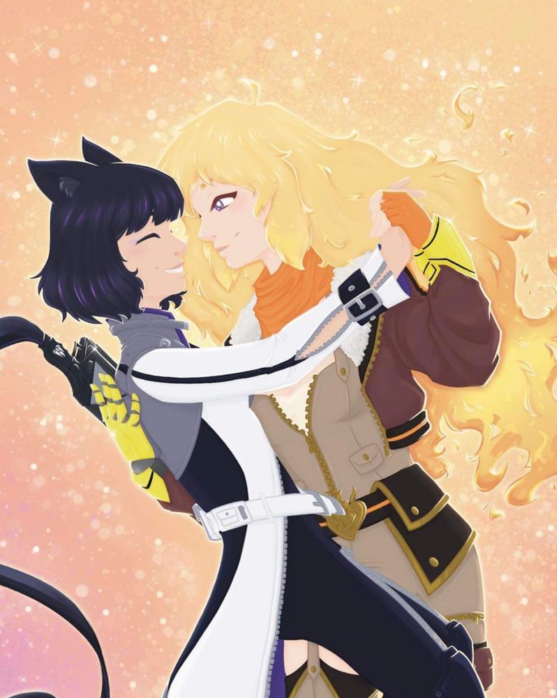 a black-haired woman (left) with cat ears looks lovingly at her partner with blond, fiery hair (right). The one on the left is Blake and the one on the right is Yang. Blake is wearing a white tailcoat with a grey overshirt. Yang has an orange scarf and a dark brown jacket. Yang is also wearing one orange gloves and her other arm is a yellow and black robot arm. Under Yang’s jacket is light brown overalls with a dark brown belt. The two girls are in a dance position, with Yang holding Blake over a light orange background. 