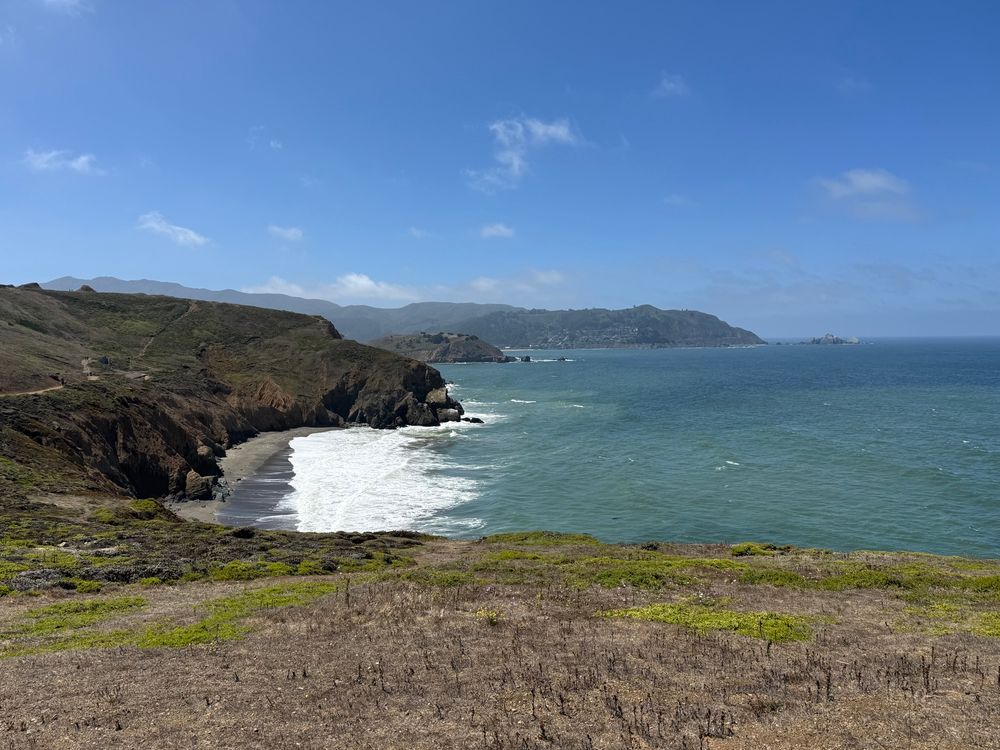 views of valleys & cliffs & the ocean from mori point trail in pacifica, california on a bright & clear day