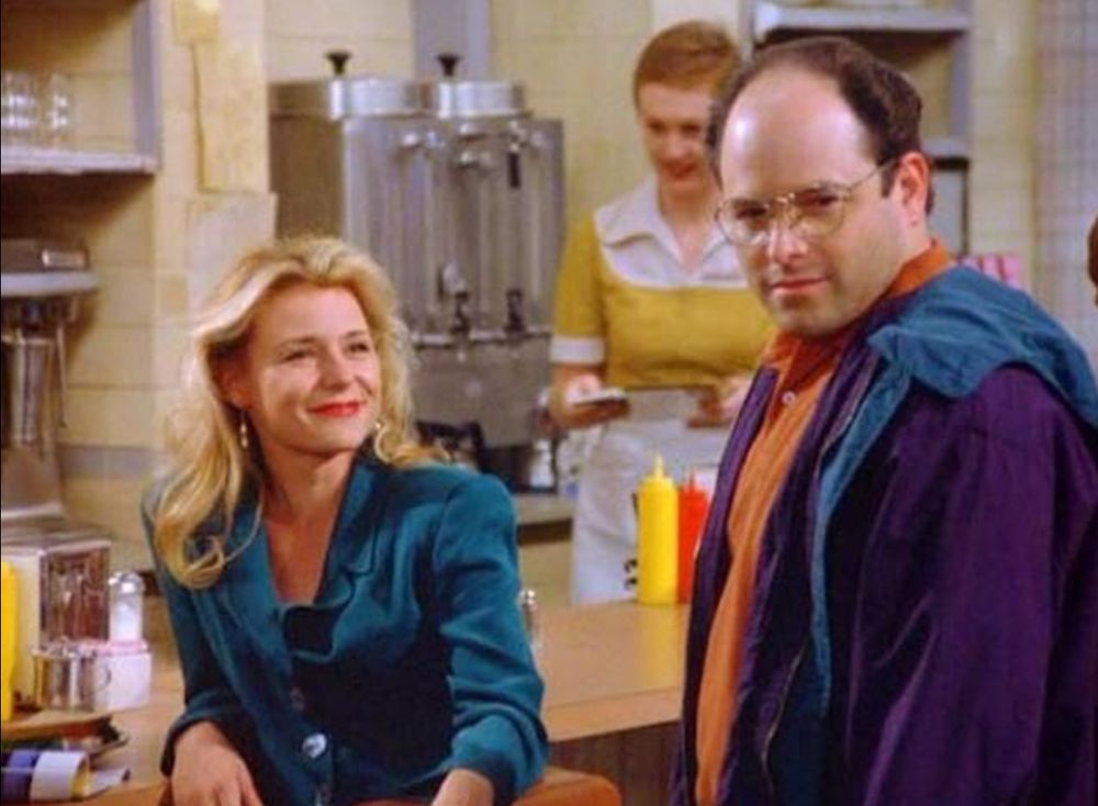 George Costanza from Seinfeld looking smug