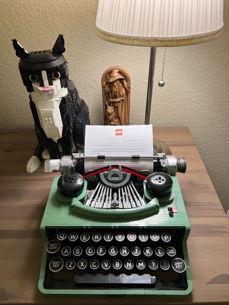 Lego typewriter, Lego cat and a wooden carving of Odin