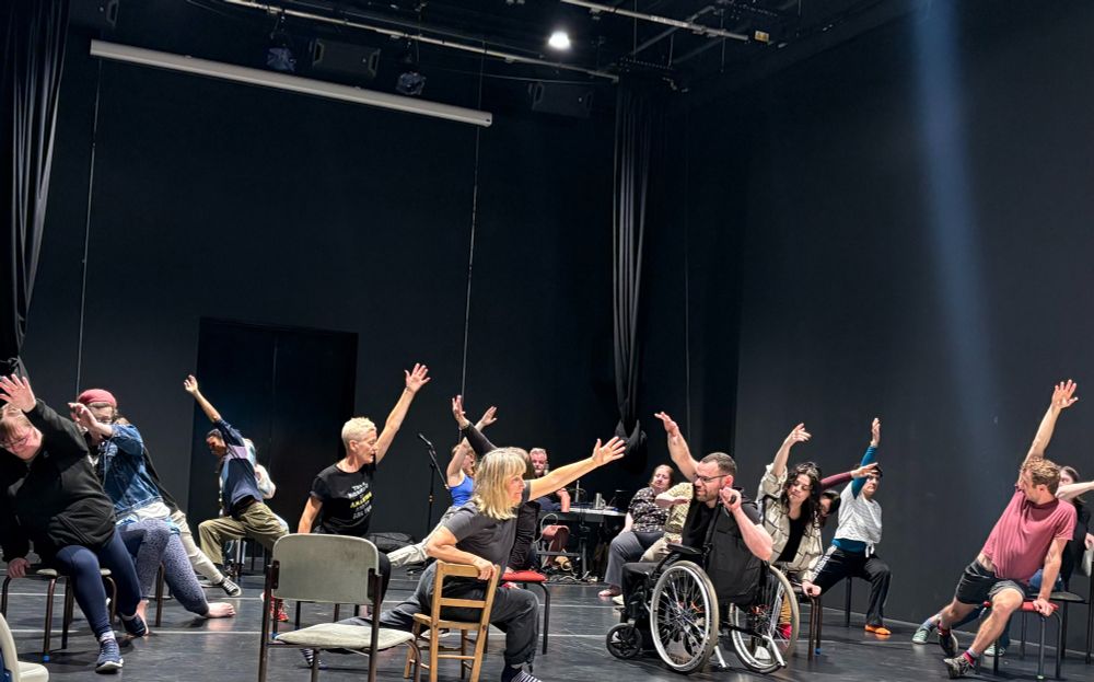 Lung Ha actors and Support Team members carry out a warm-up exercise alongside members of the Curious Seed creative team.