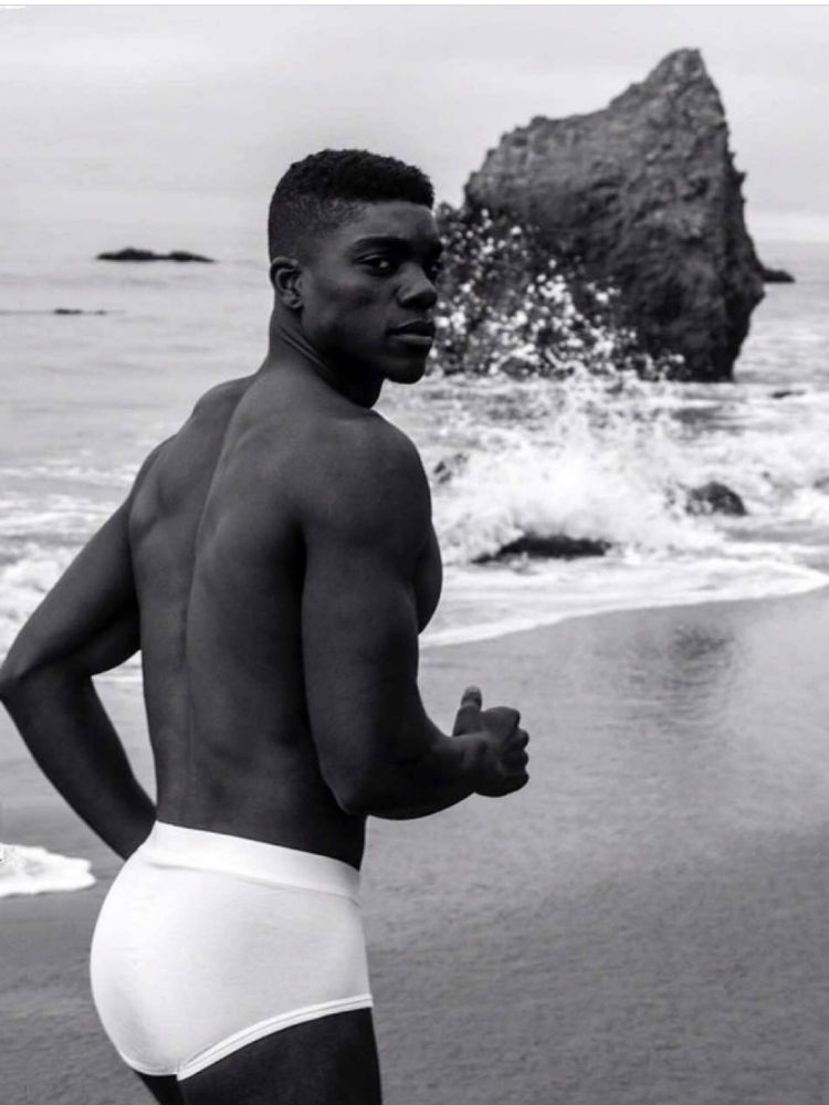 Black and white photo of this stud in his tighty whities at the beach. 😊