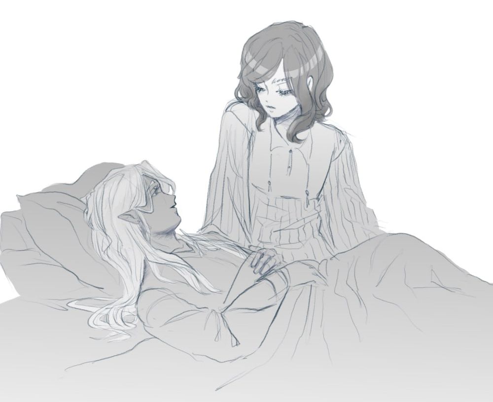 A young man with long blond hair lies on a bed and his beloved with curly dark hair sits next to him