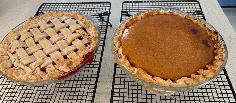 Freshly baked cherry and pumpkin pies
