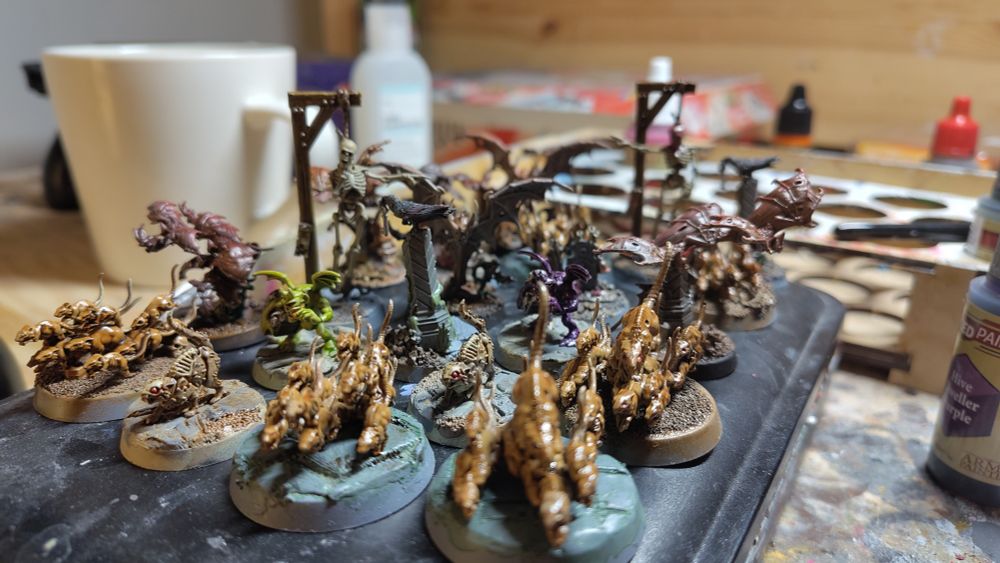 A different angle of the previous photograph; Painted 28mm scale models of giant rats, bats, ravens, tombstones, and skeletons on hangman's scaffolds