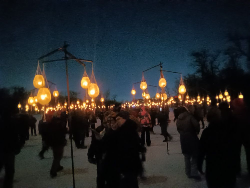 Minneapolis Luminary Loppet ice lanterns hanging above people's heads