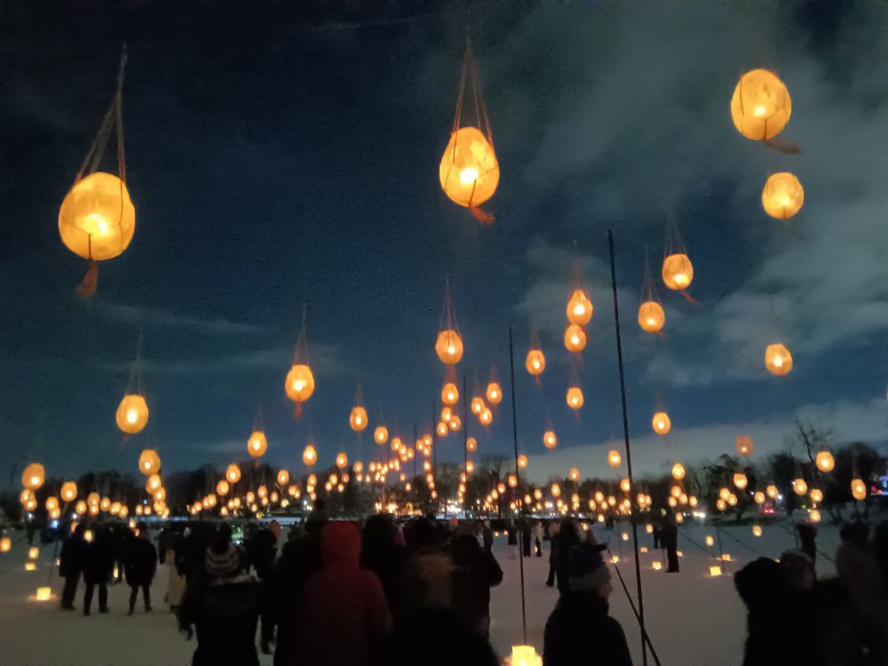 Minneapolis Luminary Loppet ice lanterns hanging above people's heads