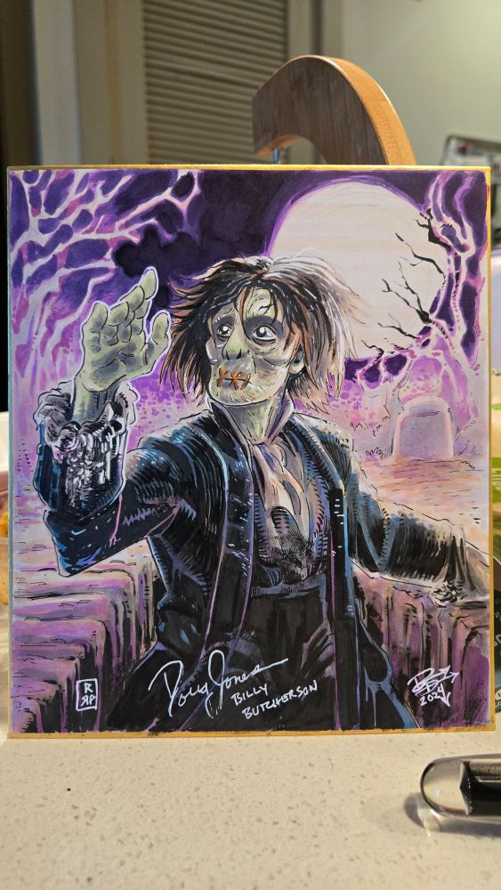 Billy butcherson (hocus pocus) rising from his grave looking as his reanimated hand in awe.