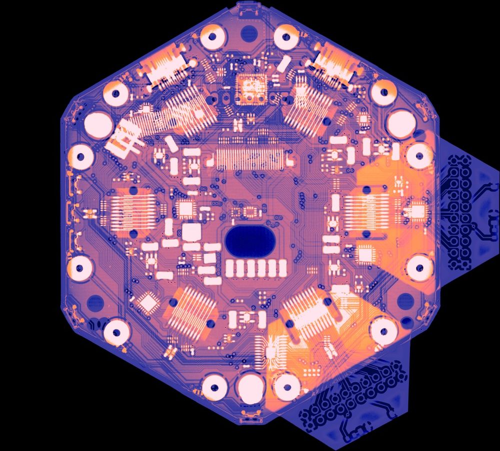 An x-ray of a Tildagon badge, with two Hexpansions plugged in.