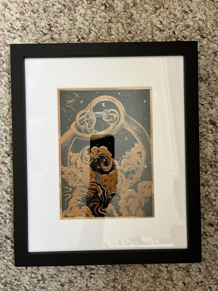 A framed print of Alexander’s Horned Sphere illustrated with a starry sky background and a wild landscape foreground 