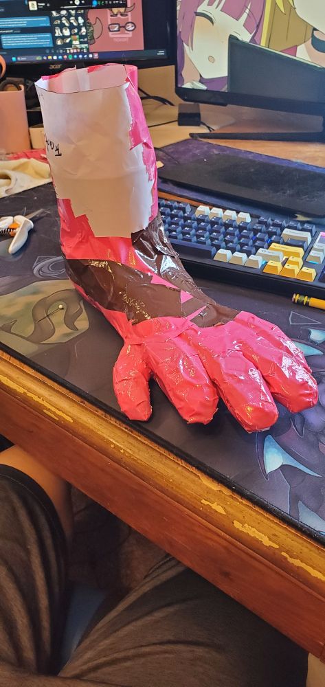 Otter fursuit toes taped up pictured from slightly above
