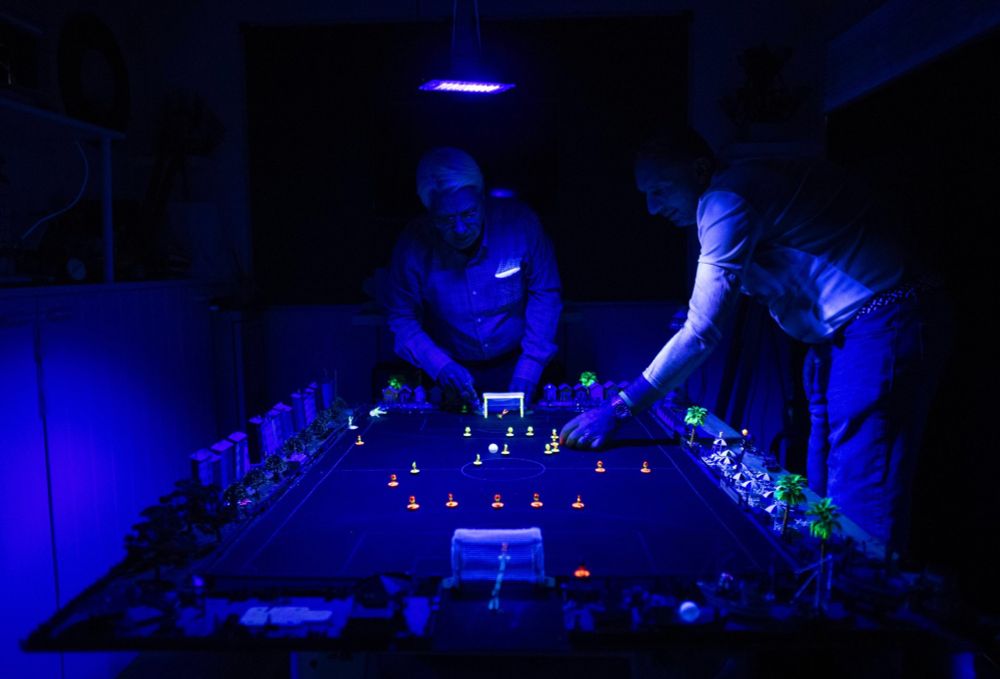 Subbuteo enthusiasts play in Stephen Morton’s house in Essex