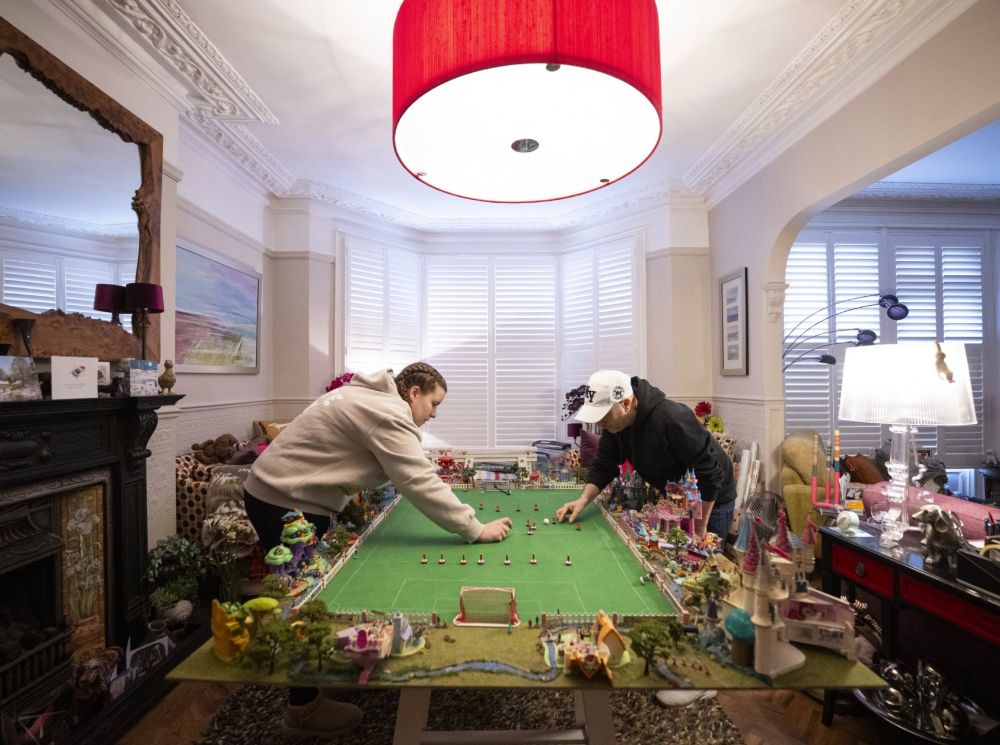 Subbuteo enthusiasts play in Stephen Morton’s house in Essex