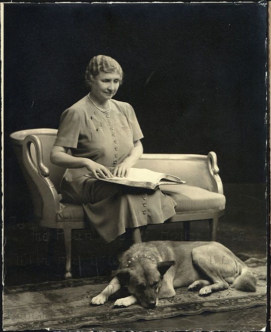 Helen Keller in 1947 with her second Akita, Kenzan-Go, a gift from the Japanese government. (Source: Archives of New Zealand)