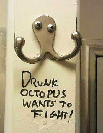 A clothes hook with text that says "drunk octopus wants to fight!" because the hook's shape resembles an octopus with eyes not facing the same way.