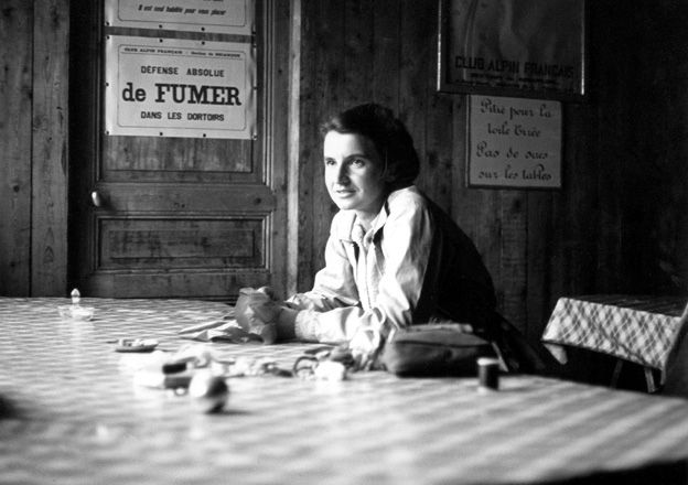 Rosalind Elsie Franklin was an English chemist and X-ray crystallographer whose work was central to the understanding of the molecular structures of DNA (deoxyribonucleic acid), RNA (ribonucleic acid), viruses, coal, and graphite.

Description:  Dr. Franklin looks across a checkered table at everyday objects.  I think this is in a cafe or a breakroom.  Since we know this is Paris, this photo is likely from 1946?