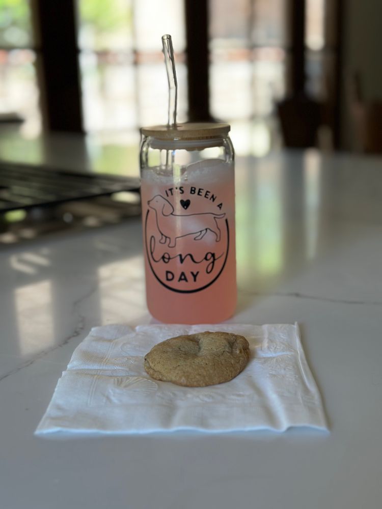 Glass tumbler with decal of a dachshund with wording It’s Been A long Day