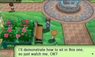 imagem do jogo Pokémon XY, onde tem dois personagens em volta de um banco de madeira.