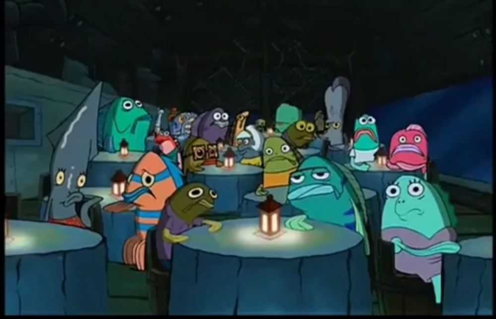 cena de bob esponja em que ele faz stand up pela primeira vez. a plateia de peixes está sentada em mesas de restaurante à meia luz, assistindo com total desprezo (pois ele é péssimo). um dos peixes grita: “oh, brother, this guy STINKS!”