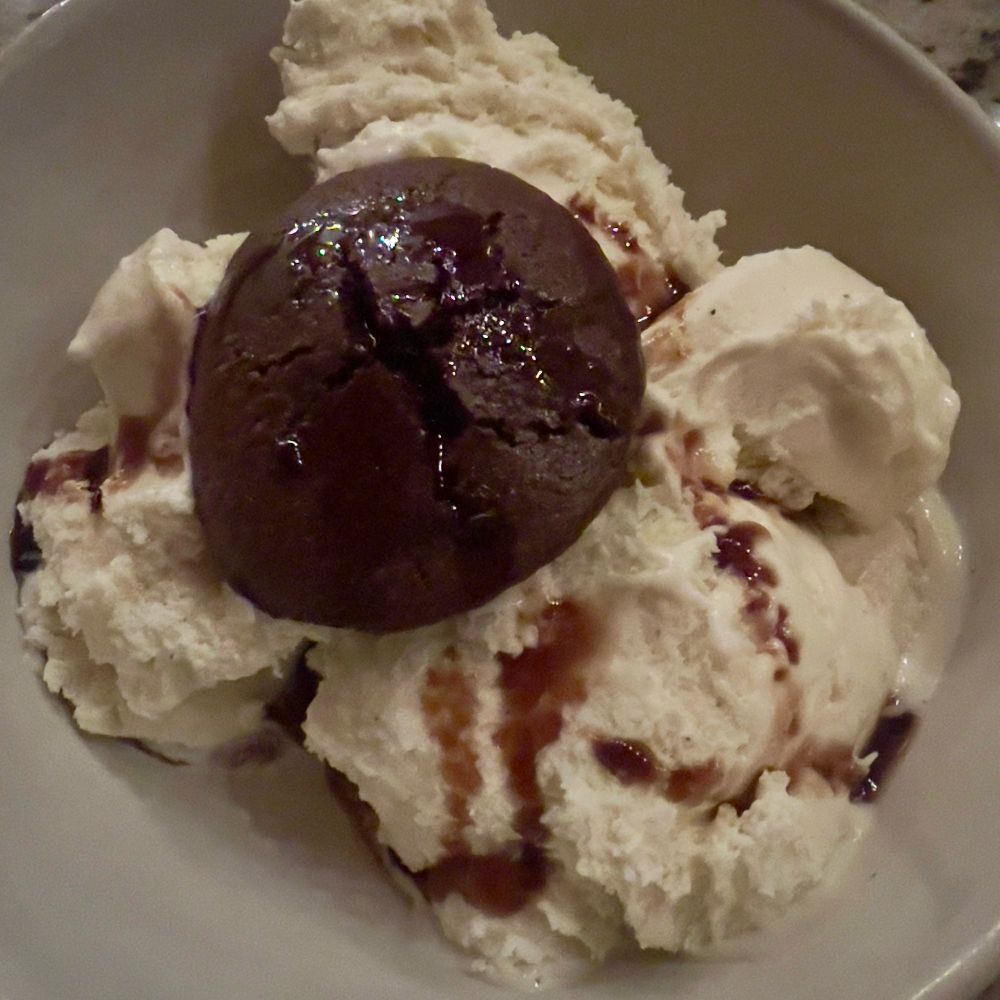 Gluten free chocolate cherry brownie soaked in reduced balsamic vinegar over vanilla bean ice cream. 