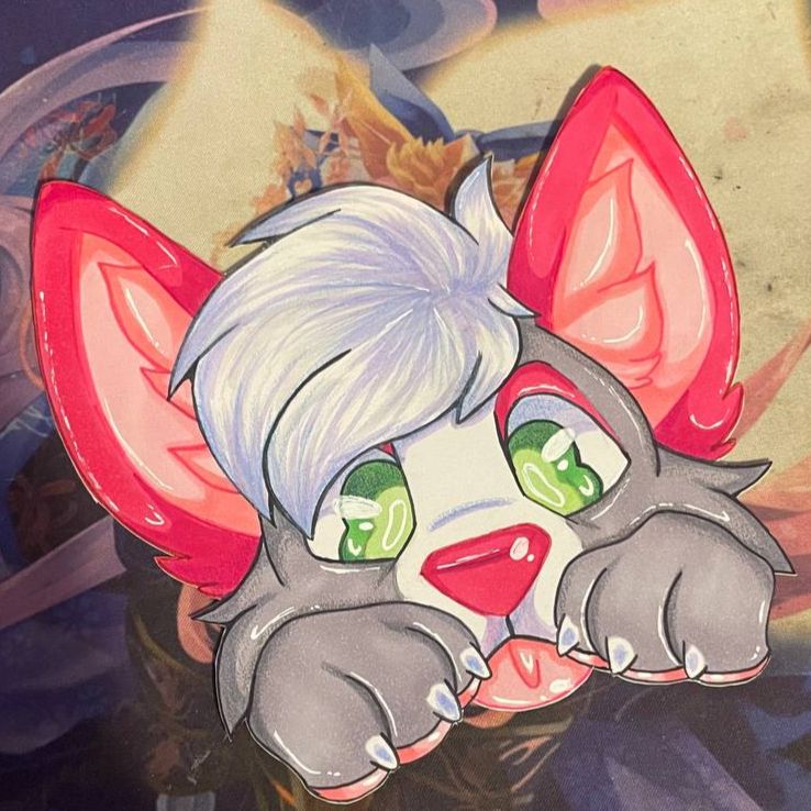 A peeker badge of a grey canine with red ears and white hair