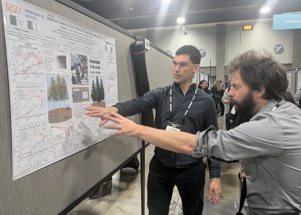 Two scientists discussing at a poster at #AGU24