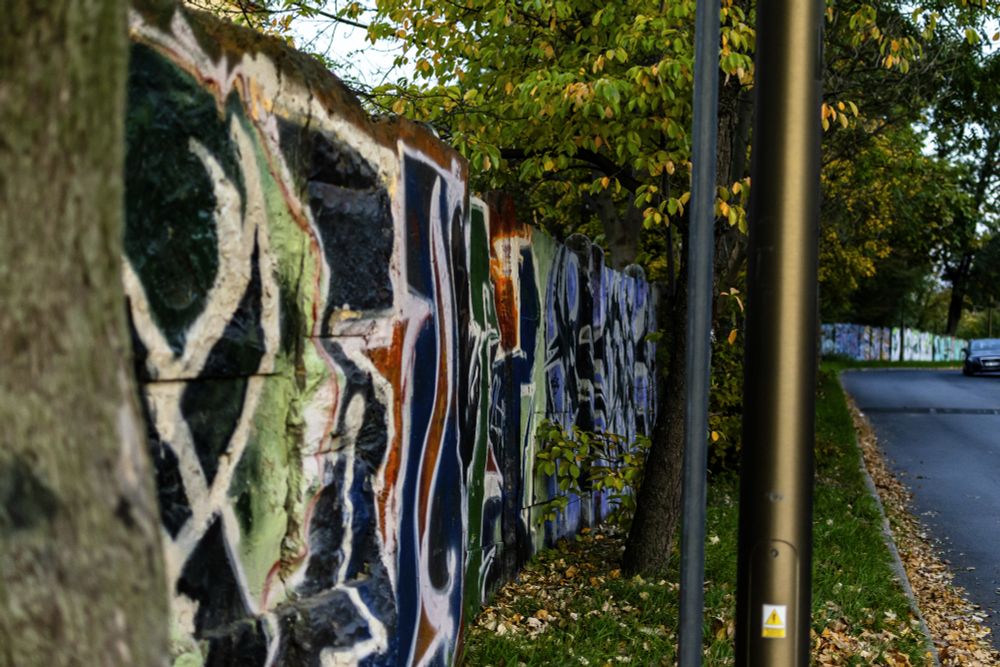 A bunch of colorful grafitti tags on a wall