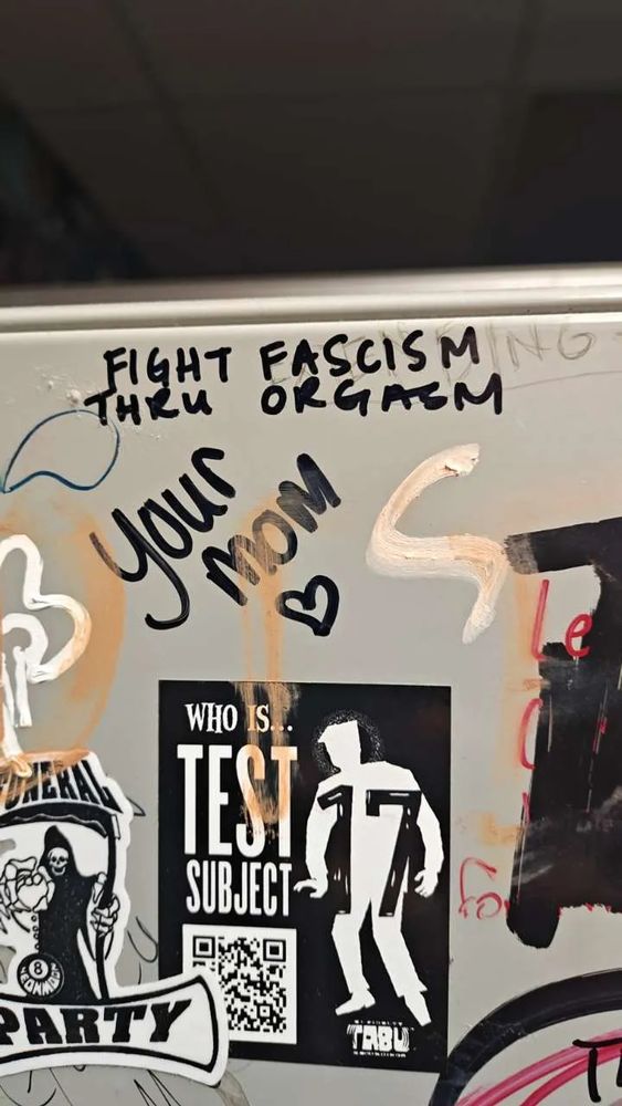 Bathroom stall graffiti that reads FIGHT FASCISM THRU ORGASM. 