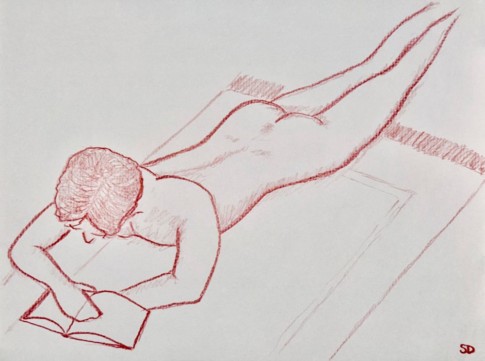 A colored pencil sketch in red of a nude model, laying on a rug, looking at a book of similarly closed models