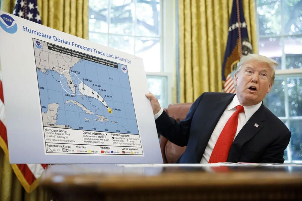 Trump shows off his sharpie'd map of Hurricane Dorian because he misspoke and cannot admit it when he frequently does that.