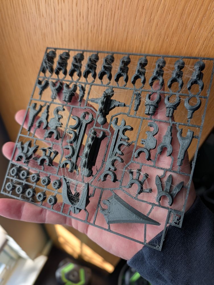 A 3d print with lots of stringing between various small pieces.