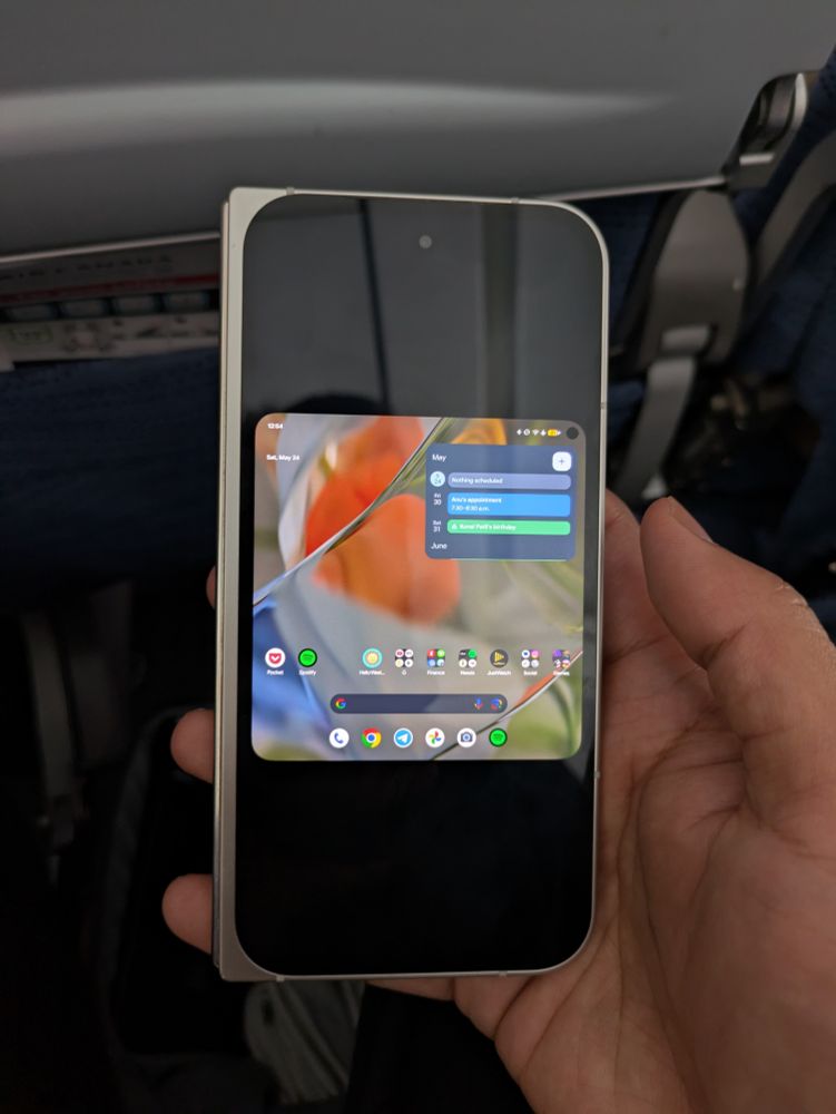 A Pixel Fold showing the unfolded large-screen UI mistakenly rendered on the smaller cover display