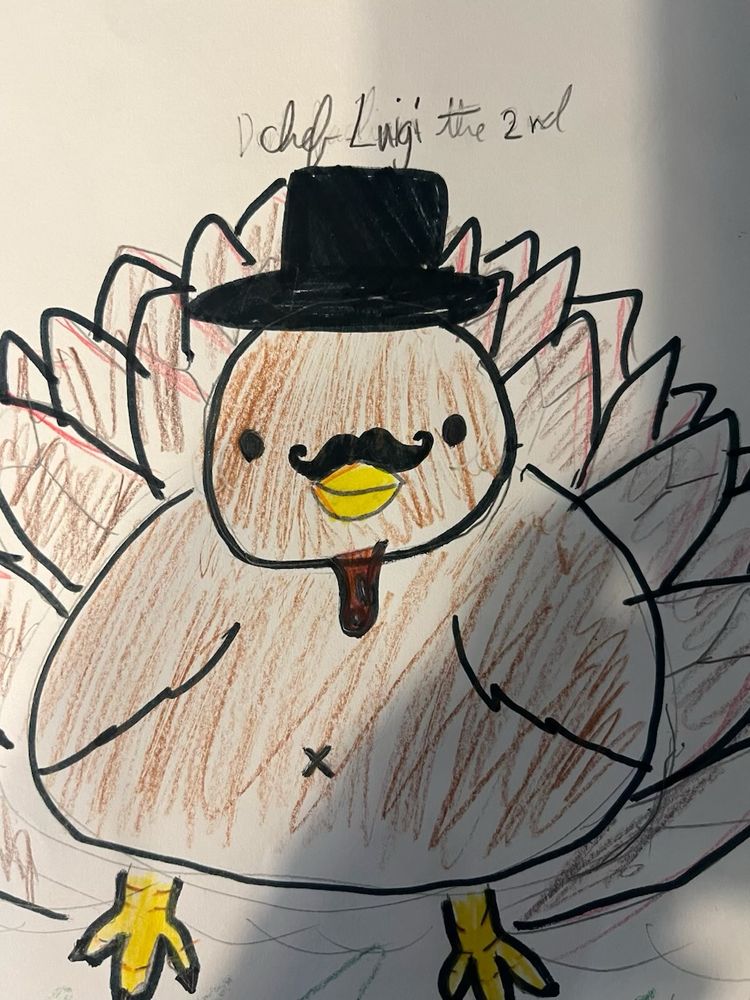 Child’s Drawing of a Turkey with a top hat and a mustache and what looks like a butthole in its belly. 