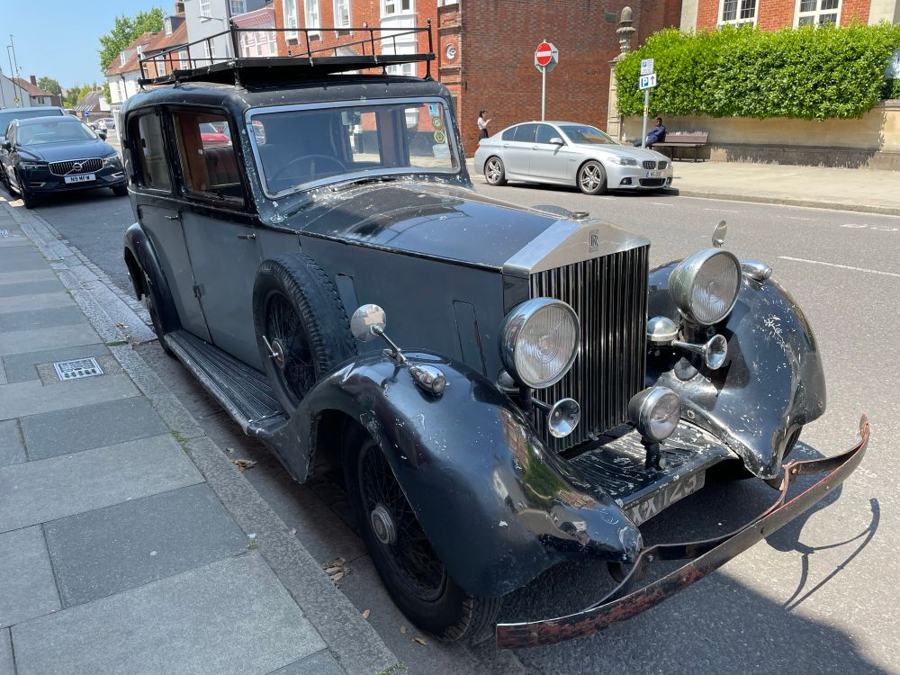 An old unloved Rolls Royce car that looks like it’s been hidden in a garage for decades.
