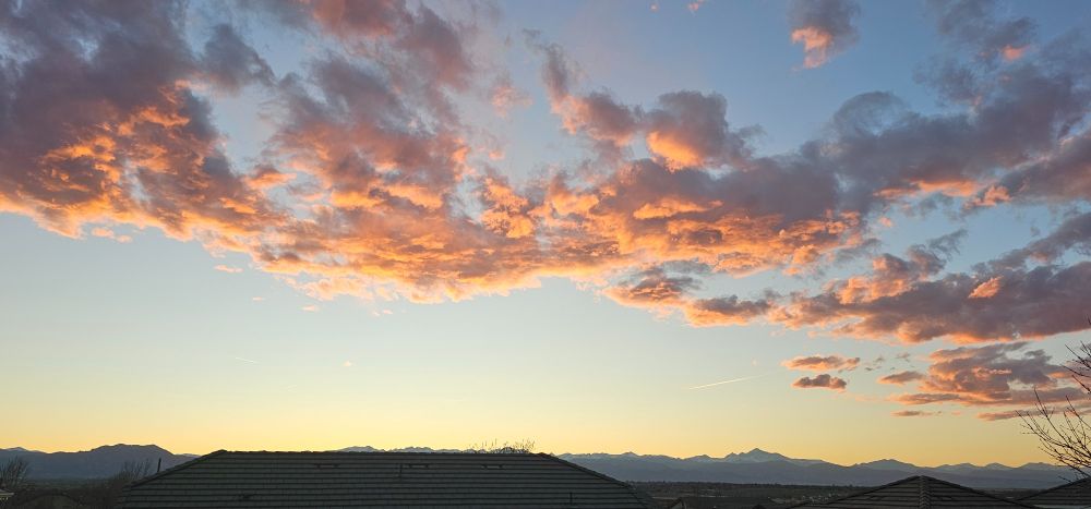 If you look closely (or zoom in), you can see a sun-illuminated contrail above and to the left of Mount Meeker/Longs Peak (center-right of photo). Photo taken at 7:20 p.m.