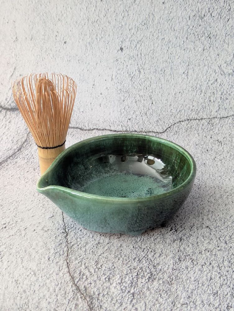 Green glazed matcha bowl with whisk
