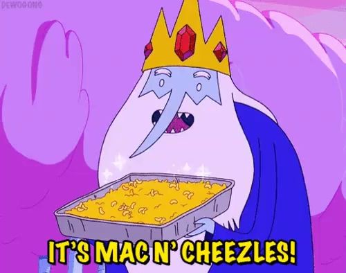 ice king from adventure time is holding a tray of mac n cheezles