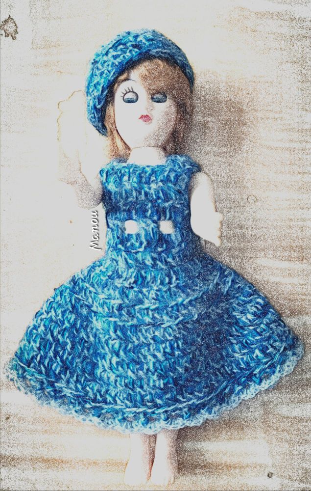 Photo of my vintage doll. Fabric looks great, and it looks in tact. My mother found it in an old container. 