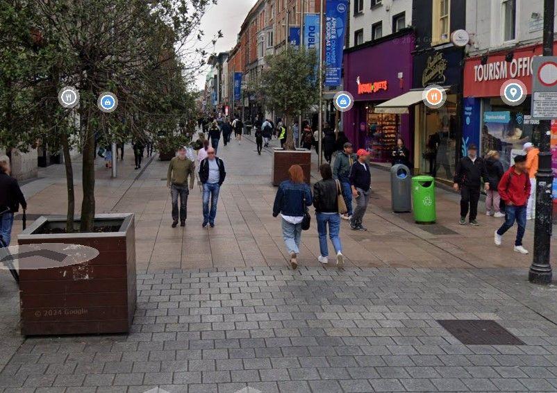 A screenshot from Google Maps Street view showing the western end of Henry Street at the Spire Dublin, with planters 20m apart allowing vehicle access to the pedestrian area